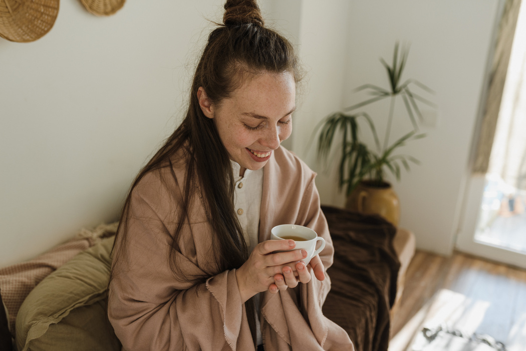 Woman Holding a Cup of Coffee